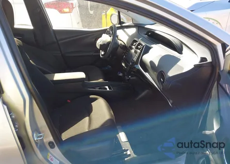 2021 Toyota Prius L Eco z USA, uszkodzony, nr VIN JTDKAMFU9M3143122